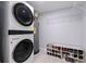 Functional utility room with washer and dryer and shelving for storage at 5932 Mckee Lake N Dr, St Petersburg, FL 33709