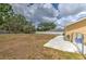 Large backyard provides ample space for outdoor enjoyment, complete with a concrete patio and secure fencing at 5939 14Th St, Zephyrhills, FL 33542
