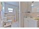 Bathroom featuring neutral tiled walls and floors and a shower at 5939 14Th St, Zephyrhills, FL 33542
