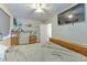 Comfortable bedroom featuring wood furniture and a ceiling fan, creating a cozy and inviting space at 5939 14Th St, Zephyrhills, FL 33542