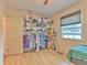 Bedroom with a walk-in closet, ceiling fan, and window for natural light at 5939 14Th St, Zephyrhills, FL 33542