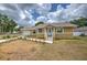 Charming single-story home with neutral stucco, white trim, and well-kept landscaping at 5939 14Th St, Zephyrhills, FL 33542