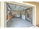 Spacious garage with organized storage, laundry hookups, and ample room for vehicles and projects at 5939 14Th St, Zephyrhills, FL 33542