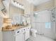 This bathroom features a glass-enclosed shower, a vanity, and soft lighting at 6104 Cognac Cir, Lutz, FL 33558