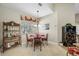 Cozy dining area features decorative light fixture and large window for ample natural light at 6104 Cognac Cir, Lutz, FL 33558