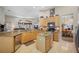 Spacious eat-in kitchen features granite countertops, stainless appliances, and convenient center island at 6104 Cognac Cir, Lutz, FL 33558