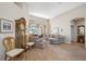Inviting living room featuring hardwood floors, neutral paint, and bright, natural light at 6104 Cognac Cir, Lutz, FL 33558