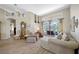 Cozy living room with hardwood floors, high ceilings, and a view of the backyard pool at 6104 Cognac Cir, Lutz, FL 33558