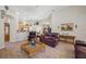 Spacious living room with high ceilings, kitchen view, and nearby dining area at 6104 Cognac Cir, Lutz, FL 33558