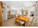 Open concept living space with hardwood floors and plenty of natural light at 6104 Cognac Cir, Lutz, FL 33558