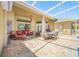 Expansive screened in patio featuring a dining area and comfortable seating at 6104 Cognac Cir, Lutz, FL 33558