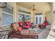 Comfortable patio with ample seating and ceiling fan, perfect for outdoor relaxation and entertaining at 6104 Cognac Cir, Lutz, FL 33558