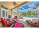 Screened in patio featuring a pool, dining area, and comfortable seating at 6104 Cognac Cir, Lutz, FL 33558