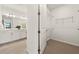 Bright bathroom and walk-in closet offers ample storage and a private space at 6137 Wire Grass Ct, Nokomis, FL 34275