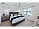 Serene main bedroom with a decorative ceiling, large window, and stylish furnishings offers a peaceful retreat at 6137 Wire Grass Ct, Nokomis, FL 34275
