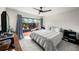 Cozy bedroom features a large window, neutral tones, and a ceiling fan at 710 N Village N Dr # 102, St Petersburg, FL 33716