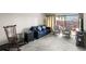 Living room with comfortable seating, including a blue sofa and rocking chair at 710 N Village N Dr # 102, St Petersburg, FL 33716