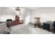 The open living room features a side view of the kitchen with breakfast bar at 710 N Village N Dr # 102, St Petersburg, FL 33716