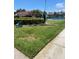 Beautiful outdoor tennis court, adjacent to green space, provides a picturesque recreational amenity at 710 N Village N Dr # 102, St Petersburg, FL 33716
