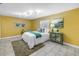 Comfortable bedroom with tile flooring, a ceiling fan, and ample natural light at 7242 55Th N Ave, St Petersburg, FL 33709