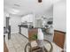 Modern kitchen featuring white cabinets, granite countertops, and stainless steel appliances at 7242 55Th N Ave, St Petersburg, FL 33709