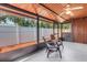 Screened lanai with comfortable seating, offering a serene outdoor living space at 7242 55Th N Ave, St Petersburg, FL 33709