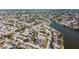 An aerial shot highlighting the proximity of homes to the canal, illustrating the community's waterfront access and layout at 7534 Culberson Dr, Port Richey, FL 34668