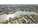 An aerial view that showcases homes near the lake, highlighting the community's access to waterfront recreation and relaxation at 7534 Culberson Dr, Port Richey, FL 34668
