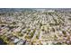 Expansive aerial view of a well-planned residential community with tree-lined streets, offering a peaceful suburban lifestyle at 7534 Culberson Dr, Port Richey, FL 34668