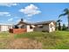 Spacious backyard featuring a green lawn, shed, and decorative patio area at 7534 Culberson Dr, Port Richey, FL 34668