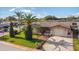 Charming single-Gathering home with a well-manicured lawn, lush landscaping, and inviting curb appeal at 7534 Culberson Dr, Port Richey, FL 34668