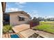Charming single-story home with a cozy patio and well-maintained landscaping under a clear, blue sky at 7534 Culberson Dr, Port Richey, FL 34668