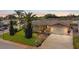 Beautiful single-Gathering home with a well-manicured lawn, lush landscaping, and a lovely curbside appeal at 7534 Culberson Dr, Port Richey, FL 34668
