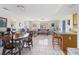 Open concept living and dining area featuring tile flooring and lots of natural light at 7534 Culberson Dr, Port Richey, FL 34668