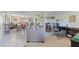 Bright living room featuring tile flooring, dining area, and dedicated office space at 7534 Culberson Dr, Port Richey, FL 34668