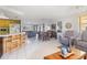 Bright, open-concept living space with kitchen bar and ample seating at 7534 Culberson Dr, Port Richey, FL 34668