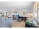 Open living room bathed in natural light, complete with a comfortable sofa and a home office setup at 7534 Culberson Dr, Port Richey, FL 34668