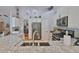 Kitchen with granite countertops, stainless steel appliances, and open layout to the living spaces at 7649 Nottinghill Sky Dr, Apollo Beach, FL 33572