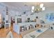 Spacious kitchen view showcasing the breakfast bar with counter seating and open floor plan at 7649 Nottinghill Sky Dr, Apollo Beach, FL 33572