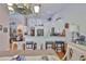 Kitchen view highlighting island seating with a large island, stainless appliances, and open space at 7649 Nottinghill Sky Dr, Apollo Beach, FL 33572