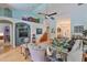 Bright living room features vaulted ceilings, clerestory wall, unique furnishings, and open floor plan at 7649 Nottinghill Sky Dr, Apollo Beach, FL 33572