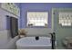 Luxurious bathroom with soaking tub, glass enclosed shower, elegant tile work, and modern fixtures at 7649 Nottinghill Sky Dr, Apollo Beach, FL 33572
