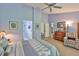 Bright main bedroom connects to a private bath, offering relaxation and convenience at 7649 Nottinghill Sky Dr, Apollo Beach, FL 33572
