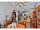 Office space boasting high ceilings, hardwood floors, decorative wall niches, and a bookshelf at 7649 Nottinghill Sky Dr, Apollo Beach, FL 33572