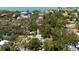 Aerial view showcasing the property's lush greenery and peaceful setting nestled among the trees at 8239 26Th N Ave, St Petersburg, FL 33710