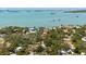 Expansive aerial view showcasing the property's proximity to the water and lush surrounding landscape at 8239 26Th N Ave, St Petersburg, FL 33710