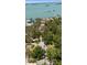 Scenic aerial view showcasing a property near the water surrounded by lush trees at 8239 26Th N Ave, St Petersburg, FL 33710