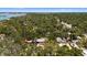 Wide aerial view showing the property's location among lush trees in a quiet neighborhood at 8239 26Th N Ave, St Petersburg, FL 33710