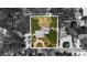 Aerial view of a home with lush landscaping, circular driveway and backyard at 8239 26Th N Ave, St Petersburg, FL 33710