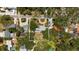 Charming aerial view of a home featuring a circular driveway and lush landscaping at 8239 26Th N Ave, St Petersburg, FL 33710